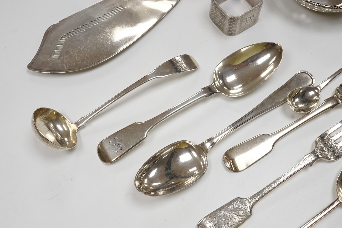 Eight assorted items of 19th century and later silver flatware including a Georgian silver fish slice(repair), various dates and makers, together with a Danish white metal spoon, a silver napkin ring and a small pierced